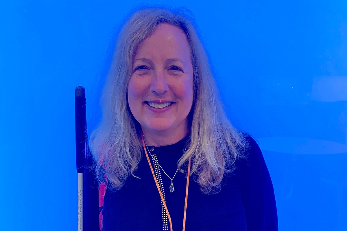 Sheri Albers against a bright blue background
