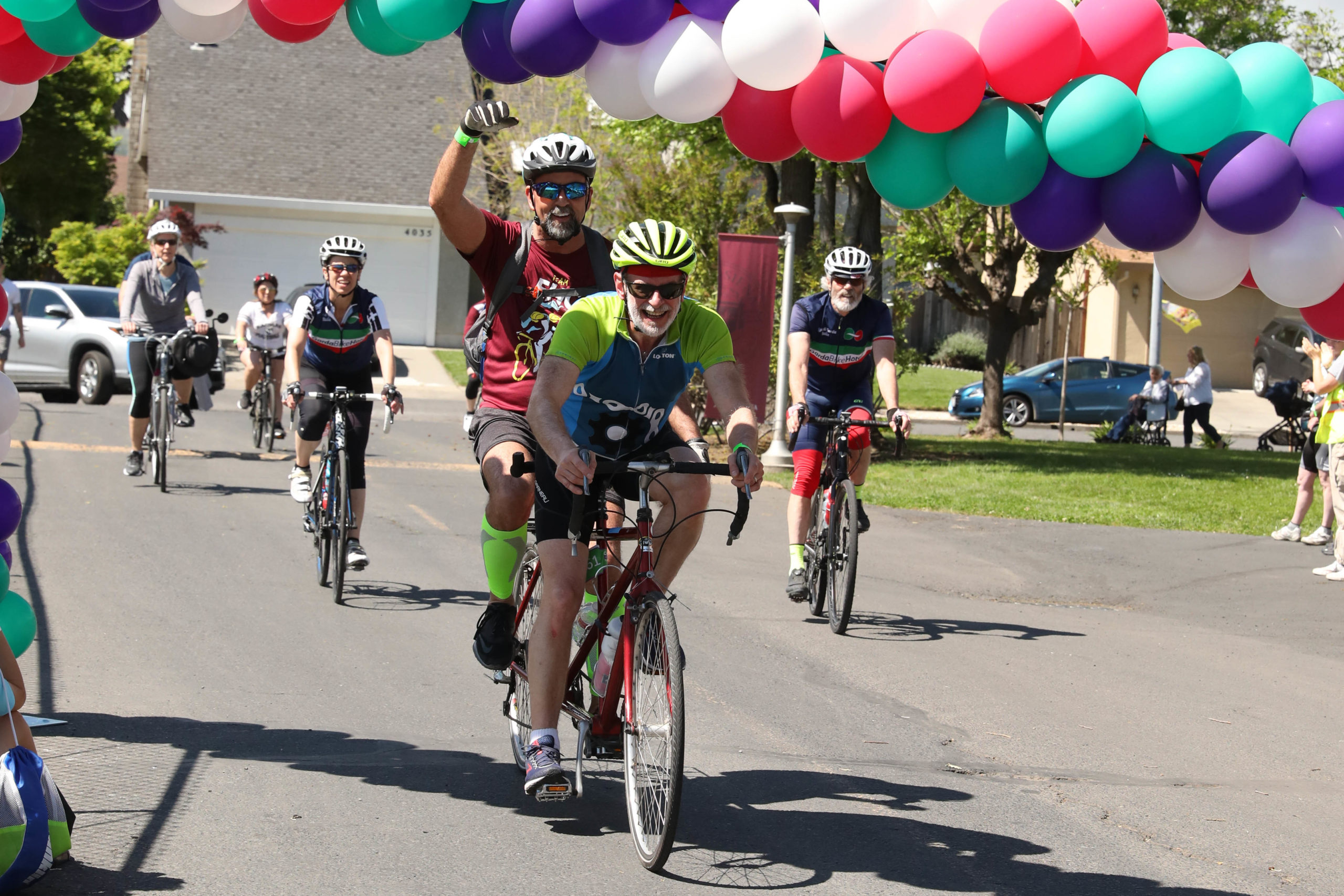 Tandem team David and Edwin ride their bike among four other bikers at Cycle for Sight in 2019