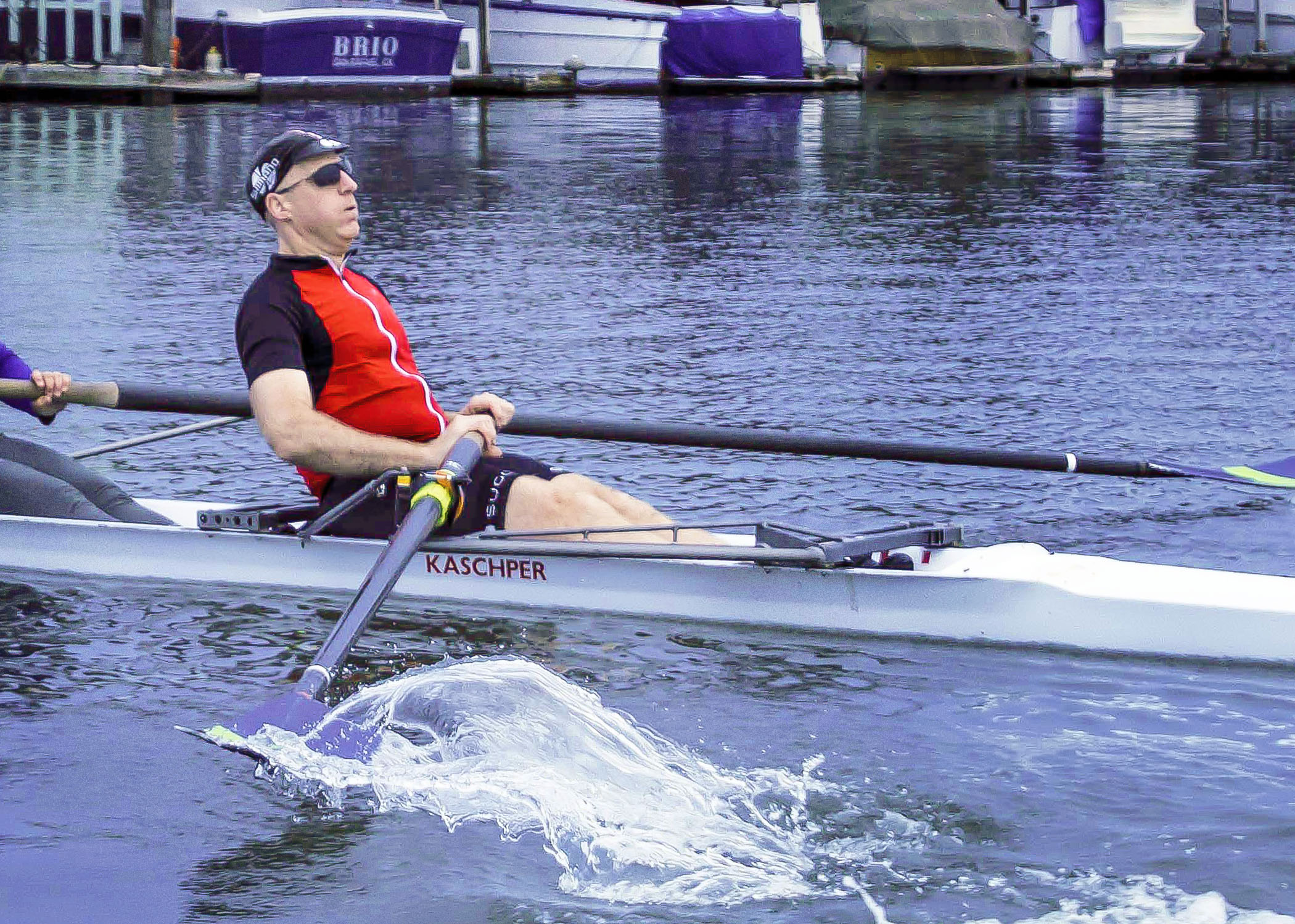 Chris Downey in a rowboat. Photo by Doug Olson, photographer