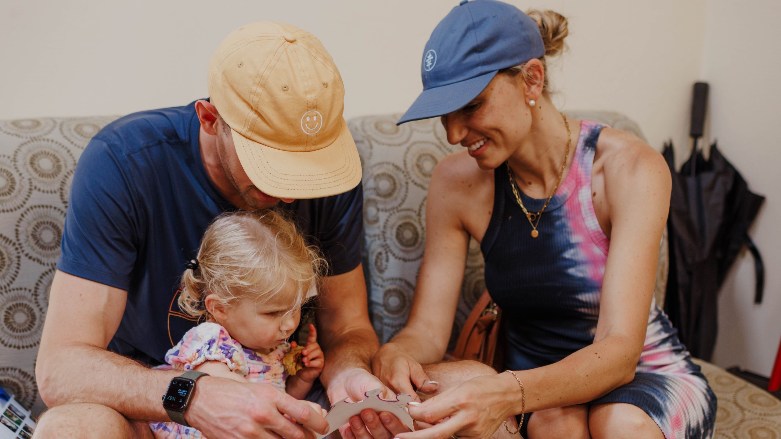 Hunter, Amanda and Little Learner sit on a couch