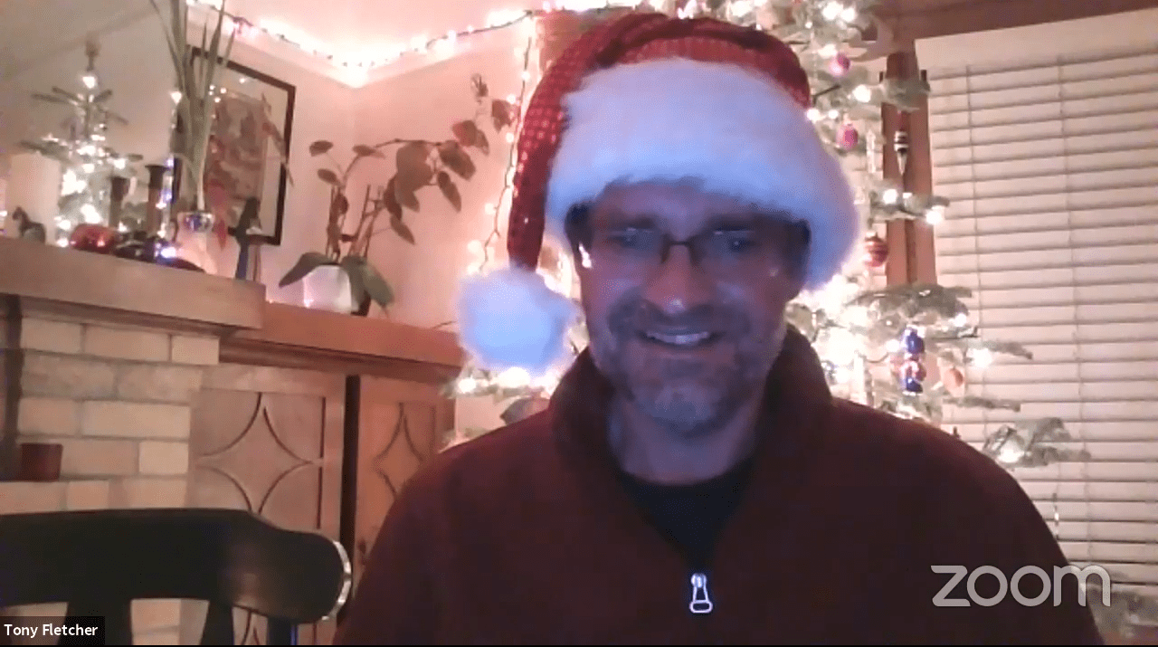 A Zoom screenshot of Camp Director Tony Fletcher wearing a Santa hat