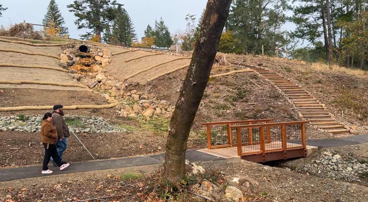 New EHC Director, Jamey Gump, and a visitor walk down a newly paved path at Enchanted Hills.