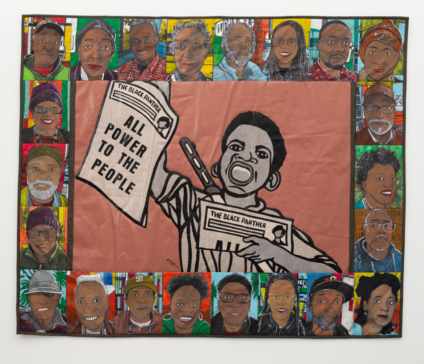 A quilt by William Rhodes – In drawing style, a boy holds a Black Panther newspaper with the headline “Power to the People”. He is surrounded by a square boarder made up of profile photos of black people of various ages.