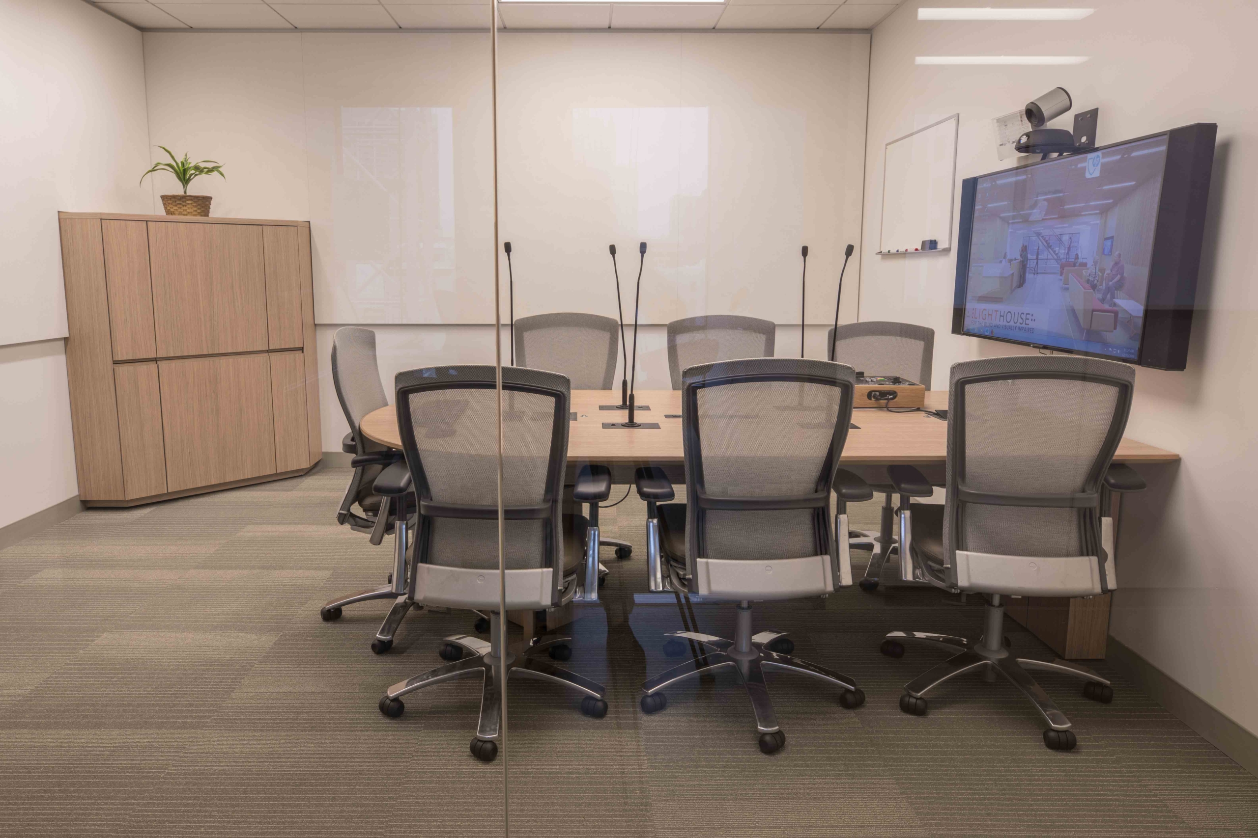 8-person conference room outfitted with AV.