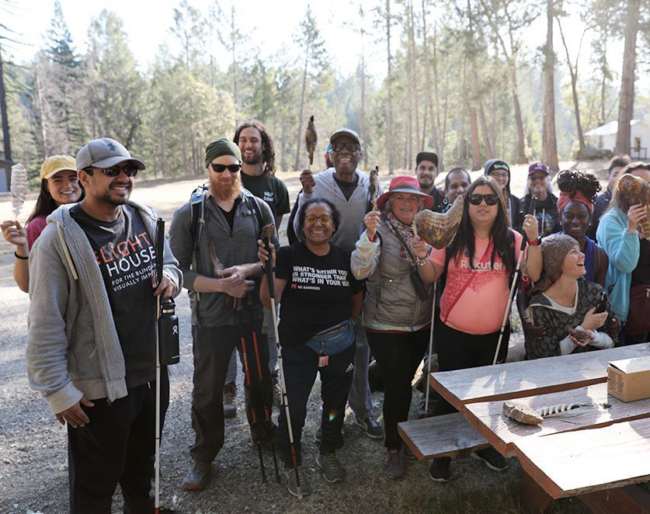 A multi-generational group of LightHouse students at a Sensing the Seasons class at Enchanted Hills Camp in 2019.
